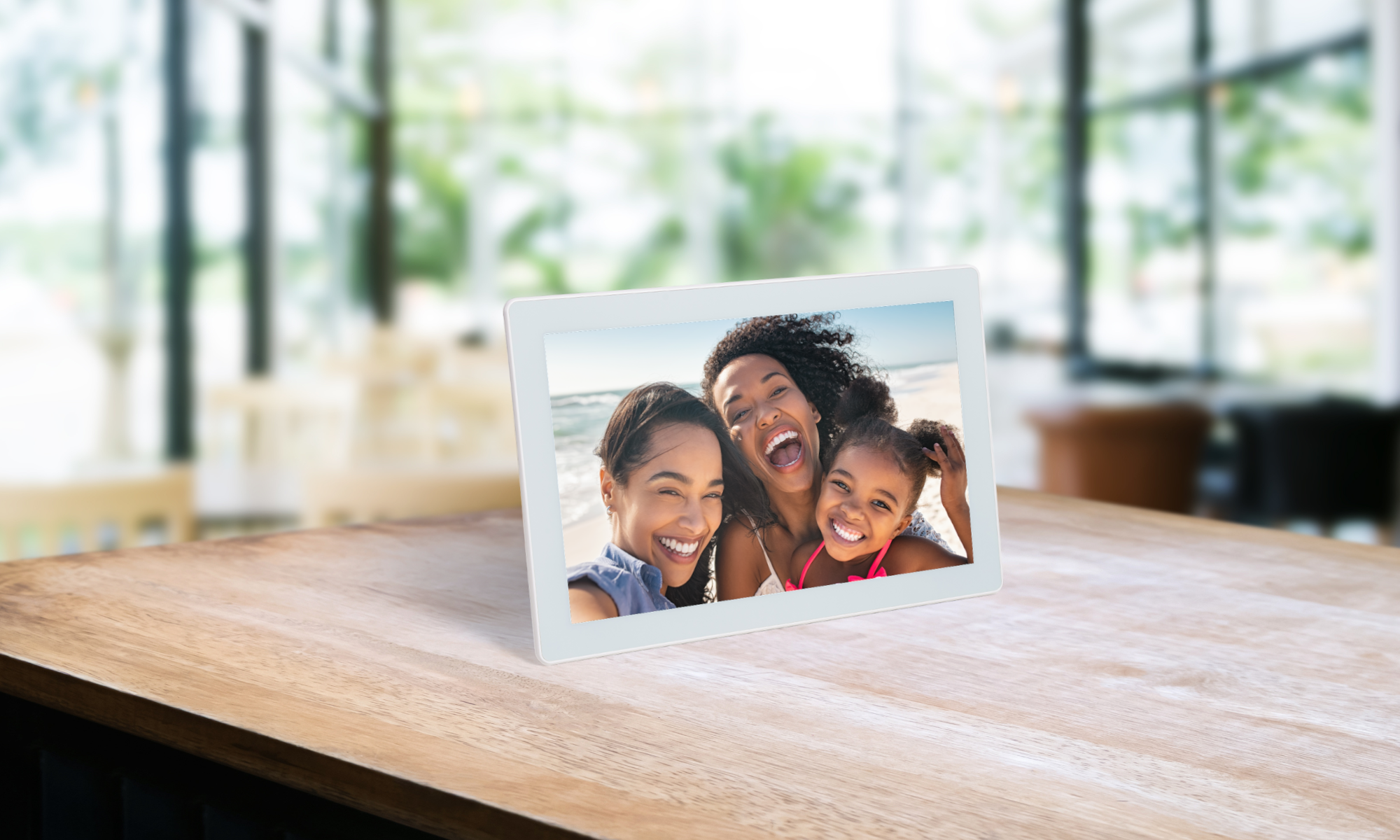 Family photo on a digital white frame placed on a counter 