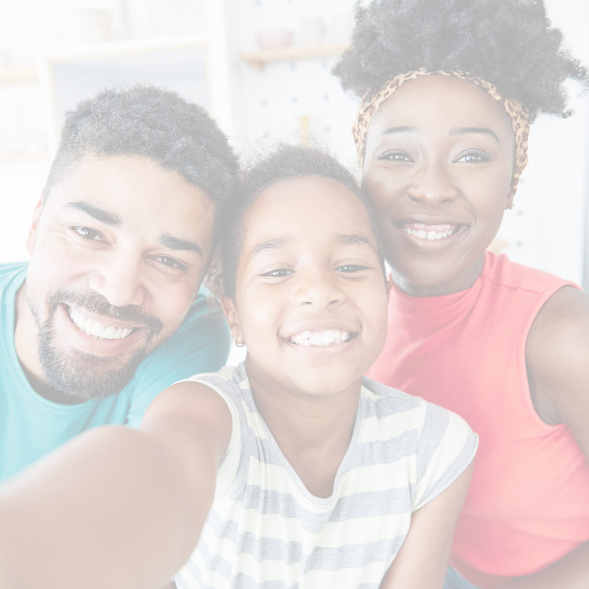 A mother, a father, and their son smiling while taking a photo