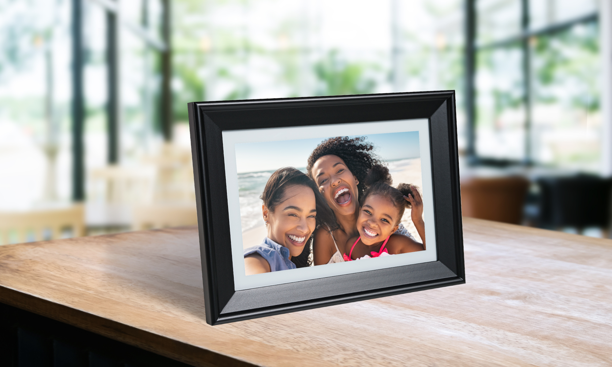 Family photo on a digital black frame placed on a counter 